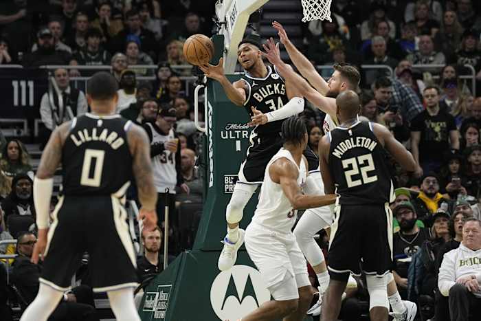 January 26, 2024; Milwaukee Bucks forward Giannis Antetokounmpo passes the ball to guard Damian Lillard at Fiserv Forum